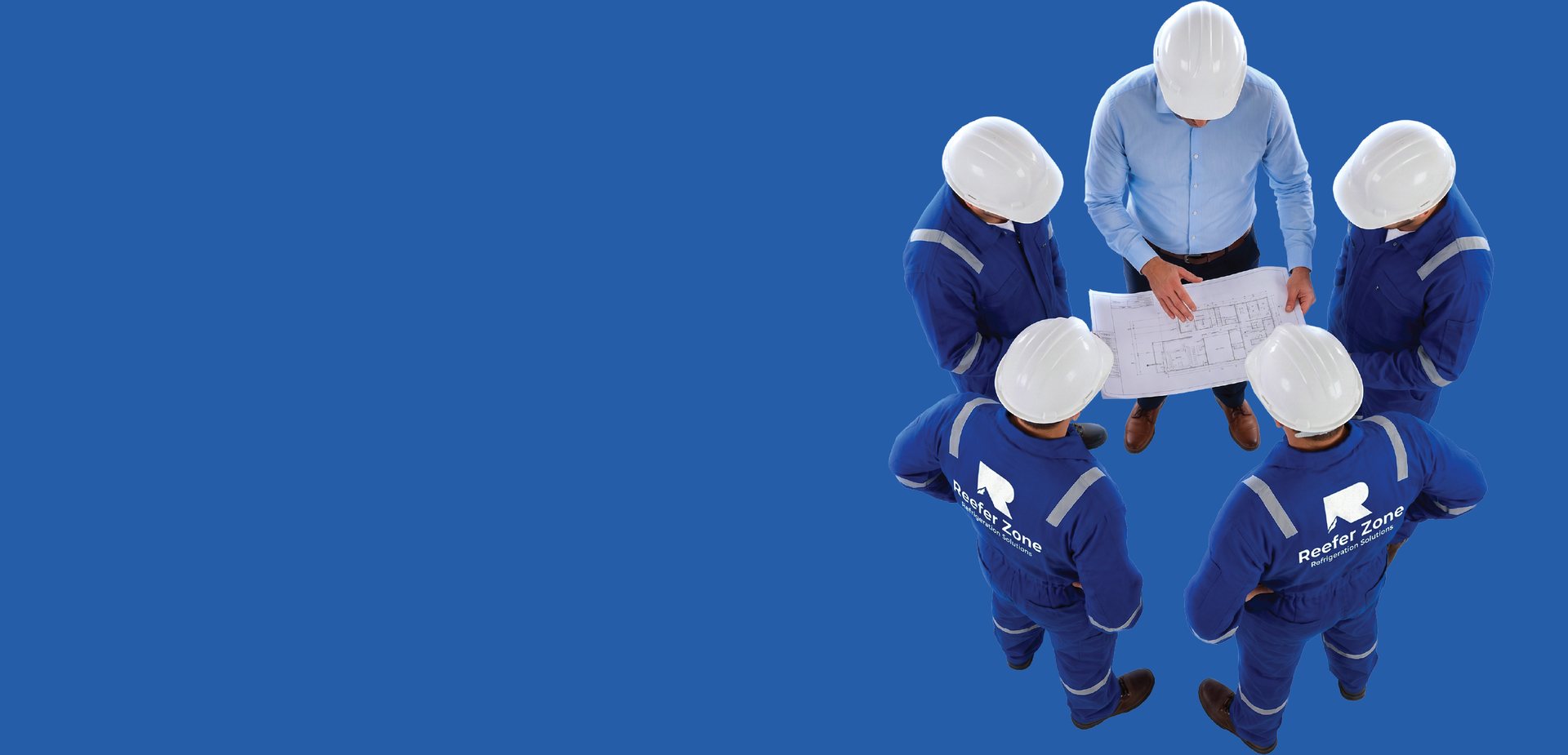 A Reefer Zone technician in a blue uniform and white hard hat